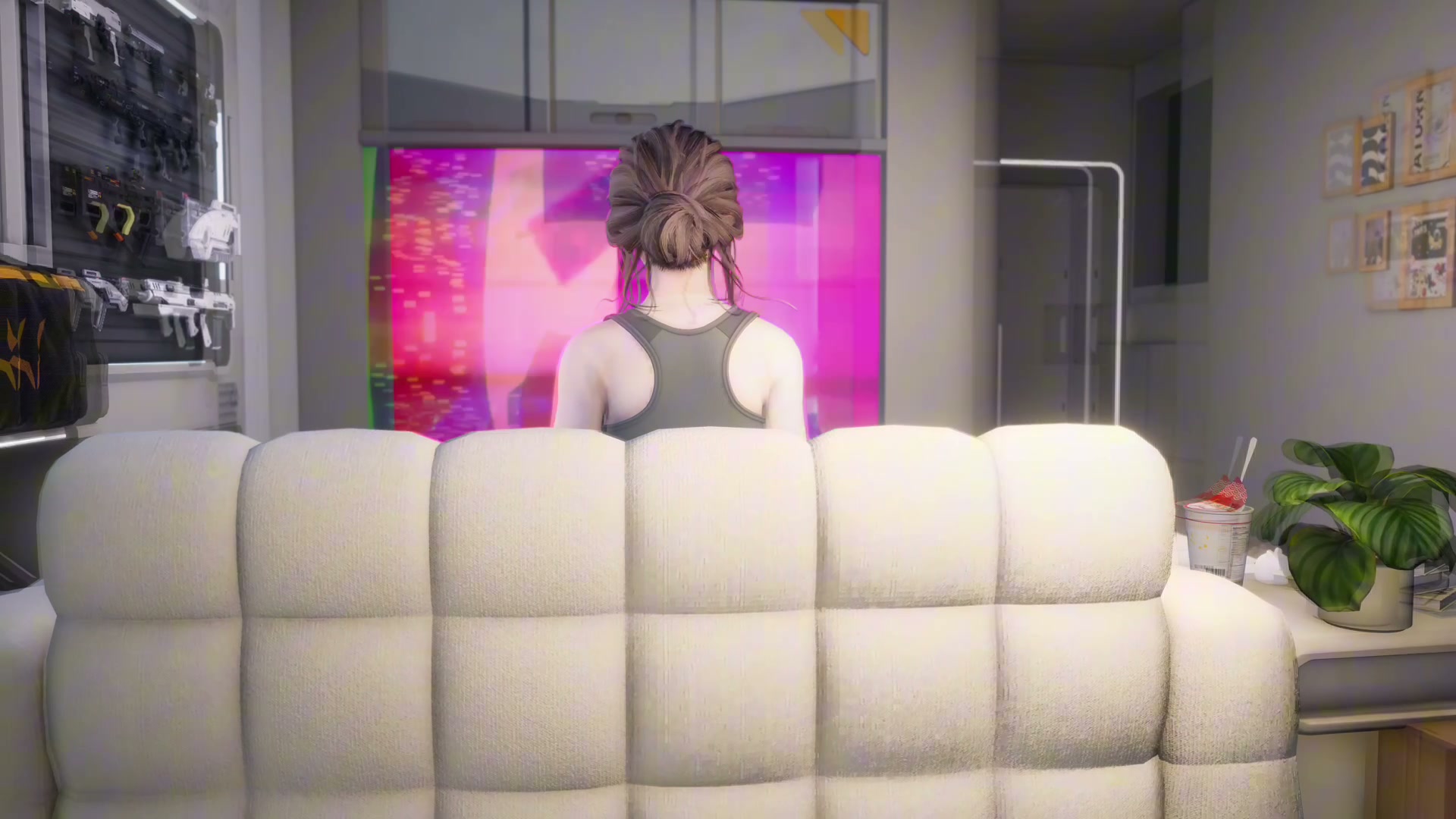 SoulLink companion 4D seen from behind on her couch, facing a glowing screen in her 3D apartment